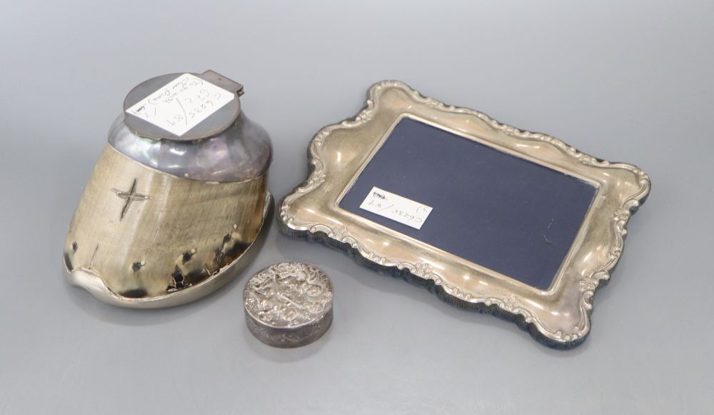 A silver photograph frame, 20.9cm, a Victorian silver patch box and a plated horses hoof inkwell.